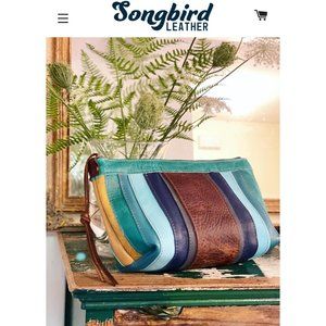 Songbird oversized striped blue leather clutch/make up bag